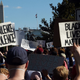 Demonstrators protesting the death of George Floyd hold up placards near the White House on June 1, 2020 in Washington, DC.